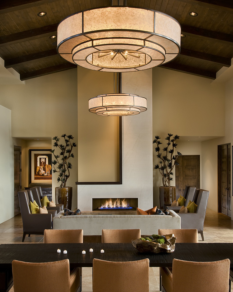 Photo of a world-inspired living room feature wall in Phoenix with beige walls and a ribbon fireplace.