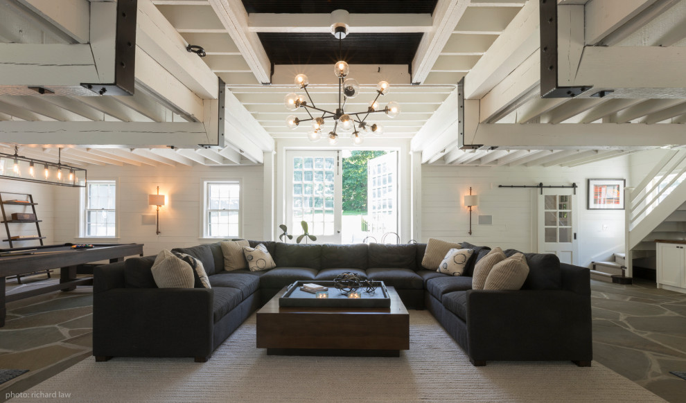 Example of a huge country living room design in New York