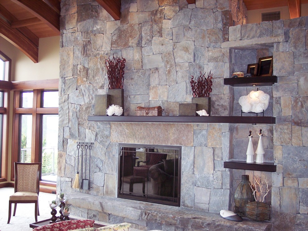 Inspiration for a contemporary living room remodel in Portland with a standard fireplace and a stone fireplace