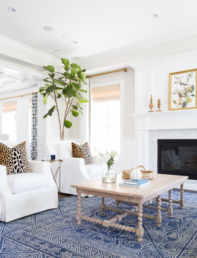 Inspiration for a classic formal living room in Los Angeles with white walls, a standard fireplace, a tiled fireplace surround, no tv and dark hardwood flooring.