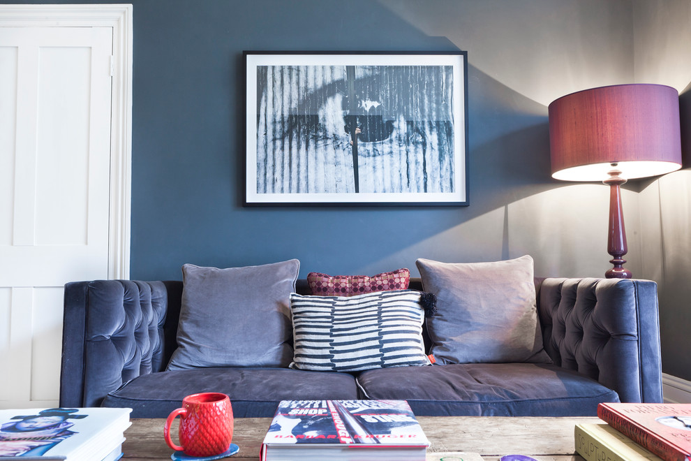 Photo of an eclectic living room in London with grey walls.