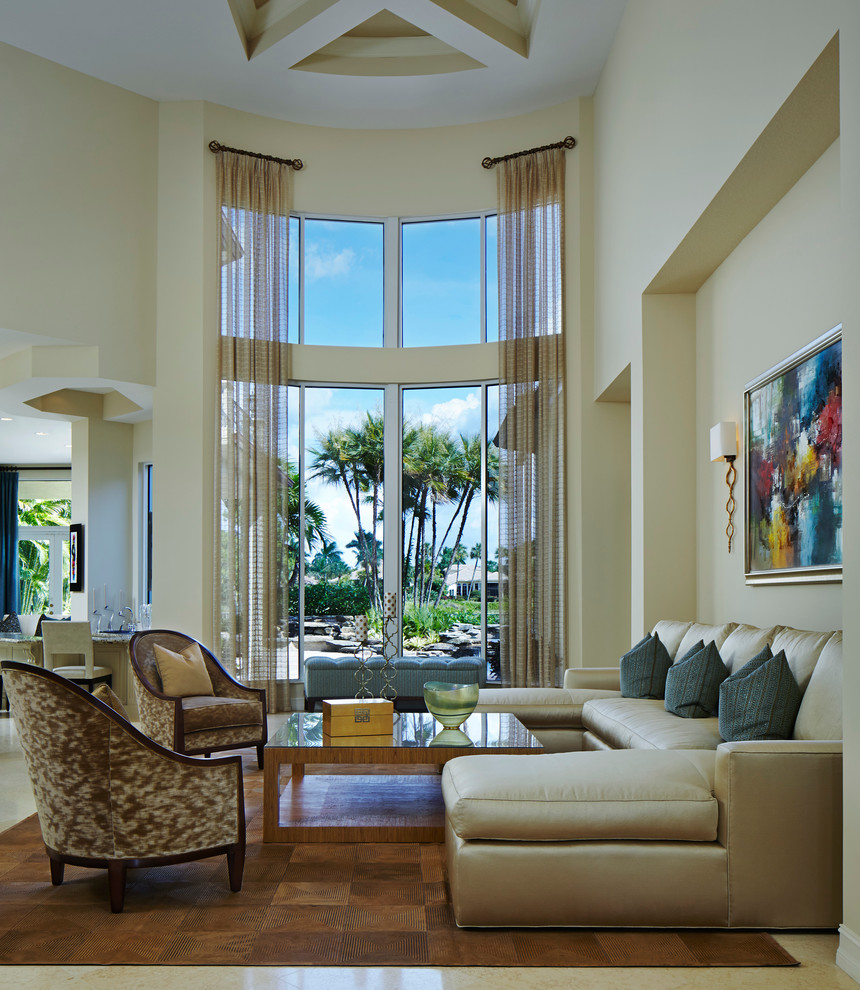 Inspiration for a transitional formal and open concept living room remodel in Miami with beige walls