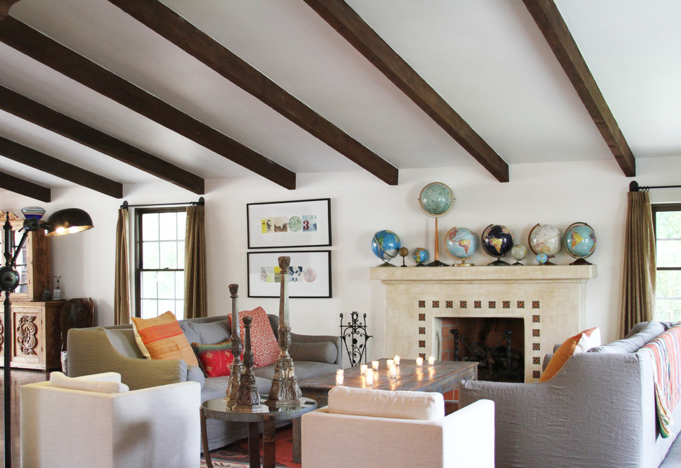Eclectic living room photo in Los Angeles with white walls and a standard fireplace