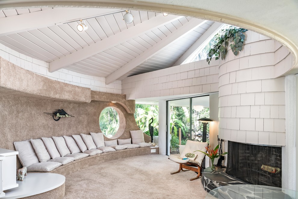 Inspiration for a mid-century modern carpeted and gray floor living room remodel in Tampa with white walls and a standard fireplace