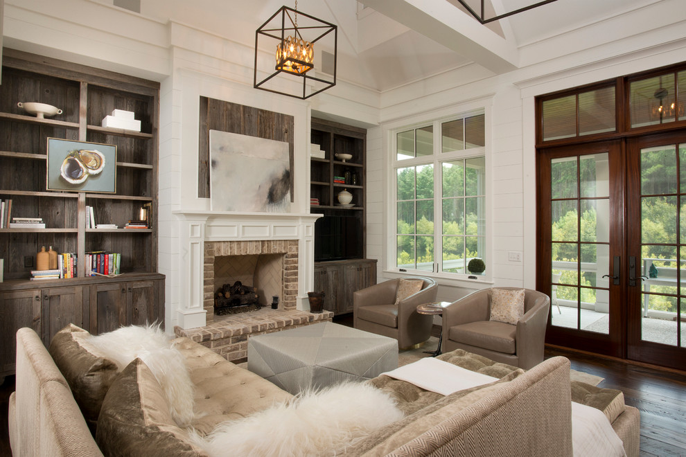 Example of a mid-sized classic formal and open concept dark wood floor living room design in Charleston with white walls, a standard fireplace and a brick fireplace