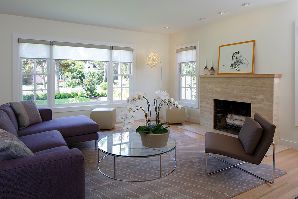 Inspiration for a mid-sized contemporary enclosed light wood floor and brown floor living room remodel in San Francisco with white walls, a standard fireplace, a stone fireplace and no tv
