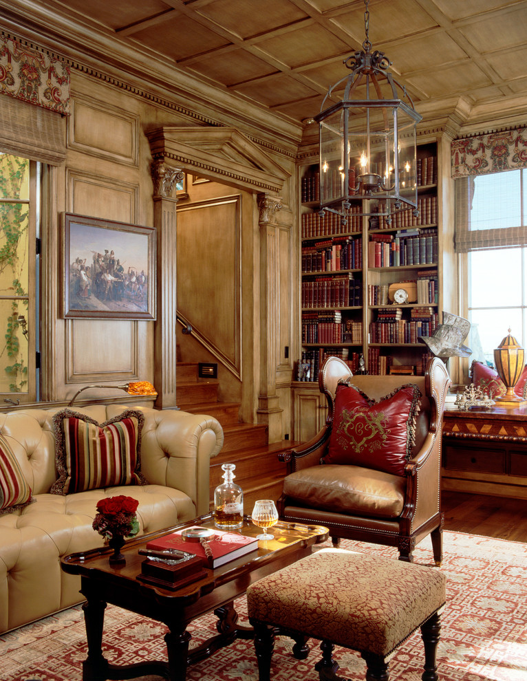 Свежая идея для дизайна: гостиная комната в средиземноморском стиле с с книжными шкафами и полками - отличное фото интерьера