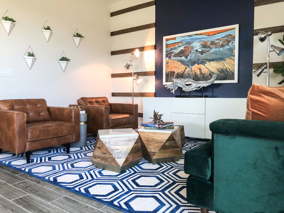 Esempio di un soggiorno design con sala formale, pareti blu e pavimento grigio
