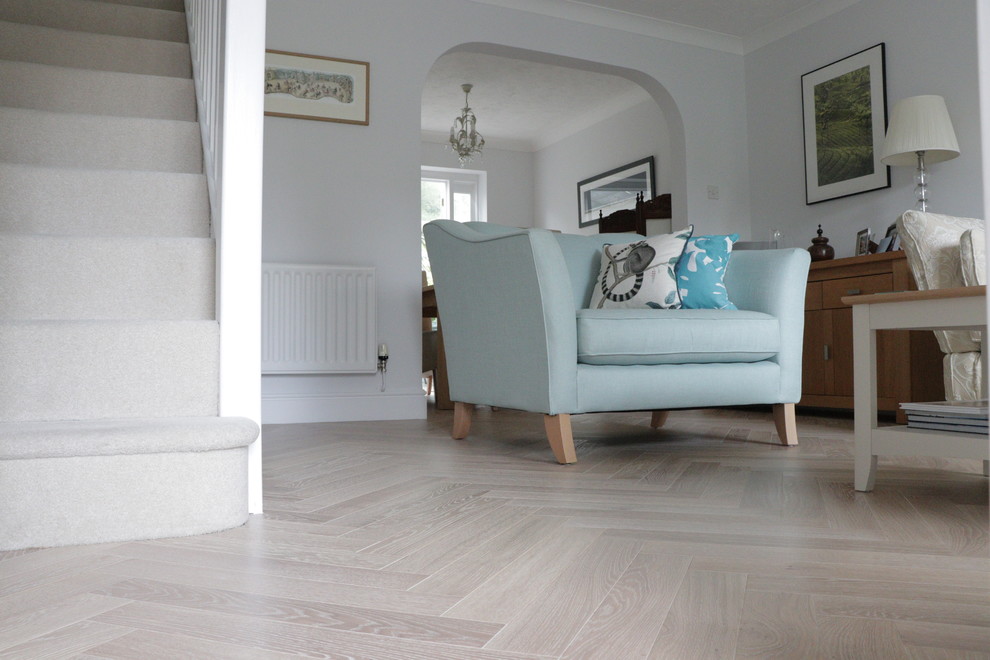 Photo of a contemporary living room in Cambridgeshire with light hardwood flooring.