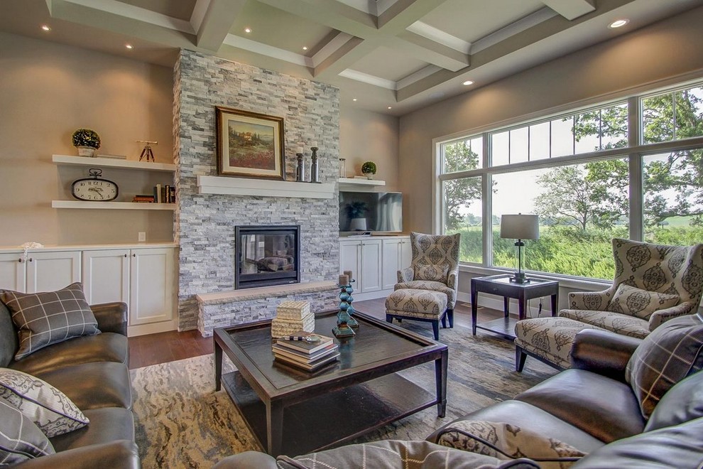 Photo of a large traditional open plan living room in Other with beige walls, medium hardwood flooring, a standard fireplace and a stone fireplace surround.