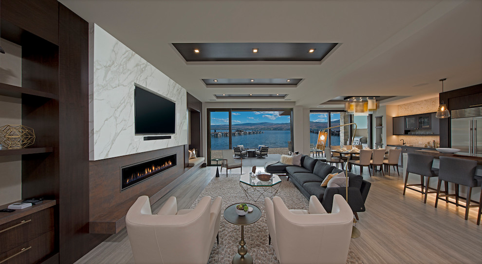 Photo of a large contemporary open plan living room in Other with porcelain flooring, a stone fireplace surround and a built-in media unit.