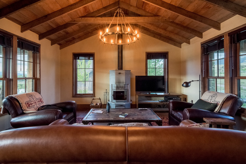 Living room - mid-sized rustic open concept dark wood floor and brown floor living room idea in Other with brown walls, a ribbon fireplace and a tv stand