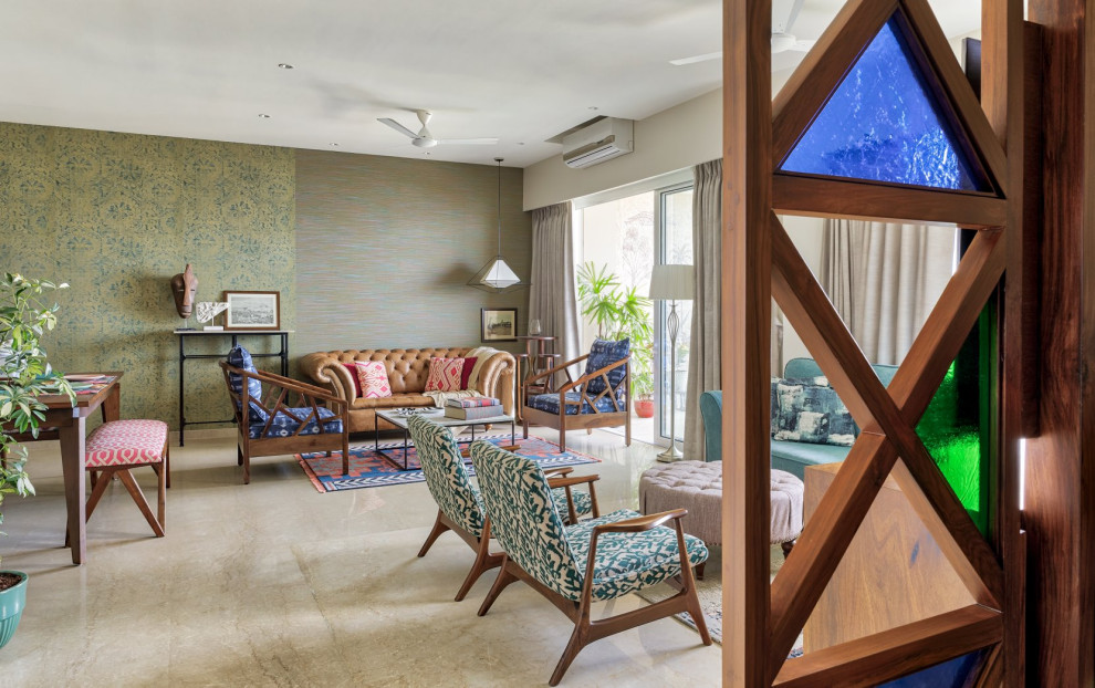 Living room - tropical living room idea in Mumbai
