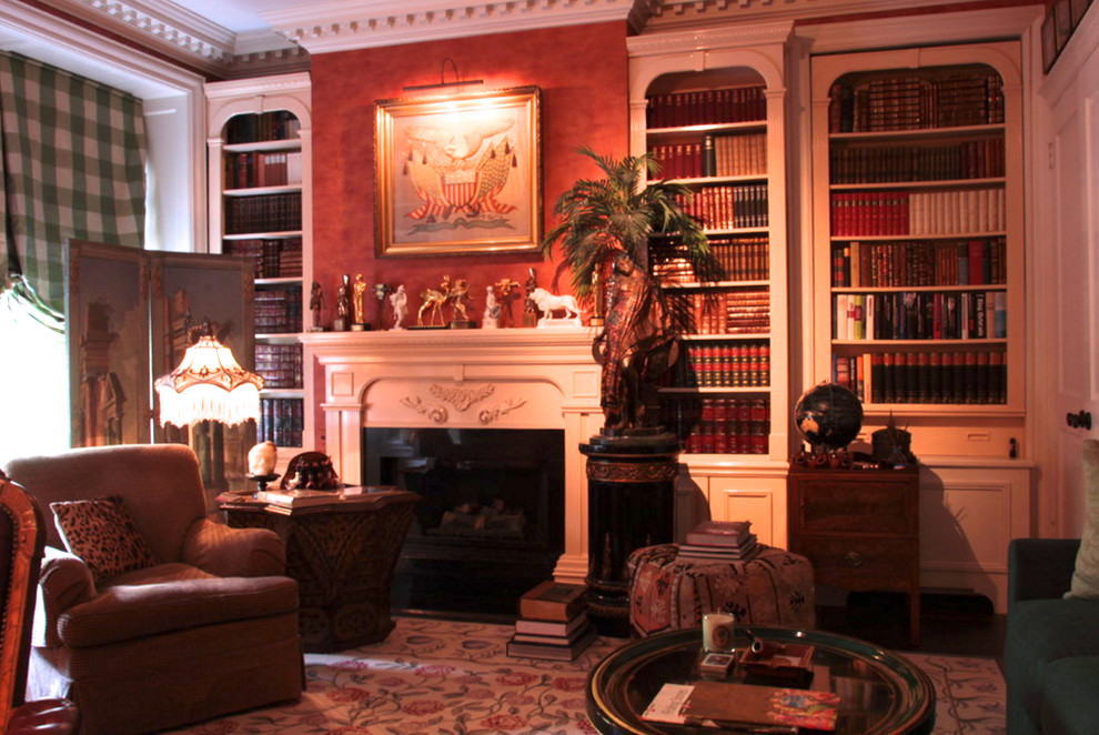This is an example of a medium sized traditional enclosed living room in New York with a reading nook, brown walls, dark hardwood flooring, a standard fireplace, a plastered fireplace surround and no tv.