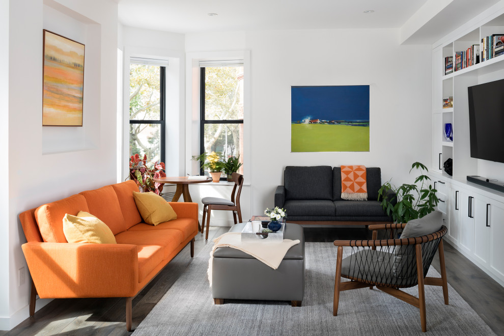 Inspiration for a contemporary living room remodel in New York with a media wall