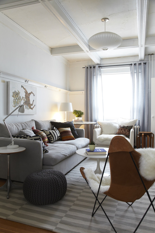 Inspiration for a mid-sized scandinavian enclosed living room remodel in Toronto with white walls