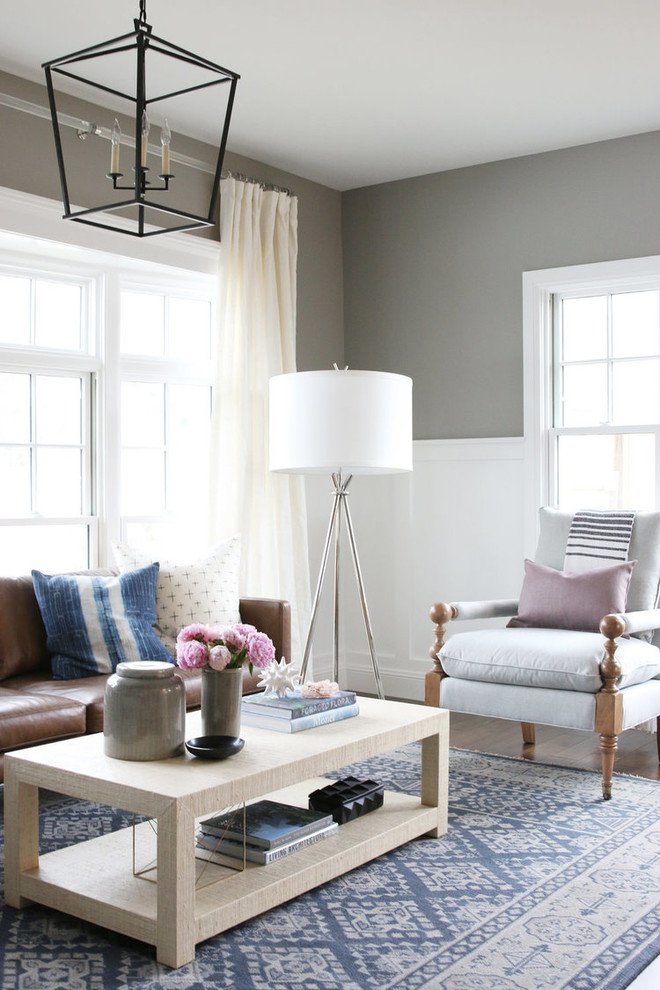Example of a mid-sized transitional enclosed dark wood floor living room design in Salt Lake City with gray walls