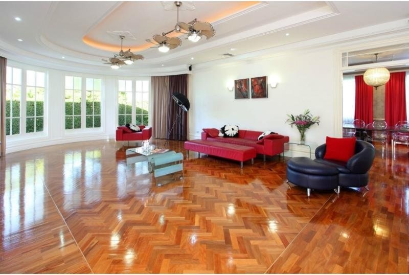 Design ideas for a contemporary living room in Brisbane with medium hardwood flooring.