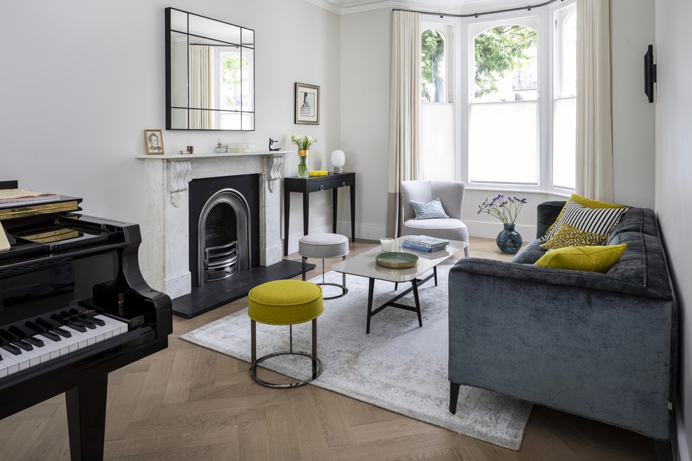 Inspiration for an expansive contemporary formal open plan living room in London with grey walls, medium hardwood flooring, a ribbon fireplace, a stone fireplace surround, no tv and grey floors.