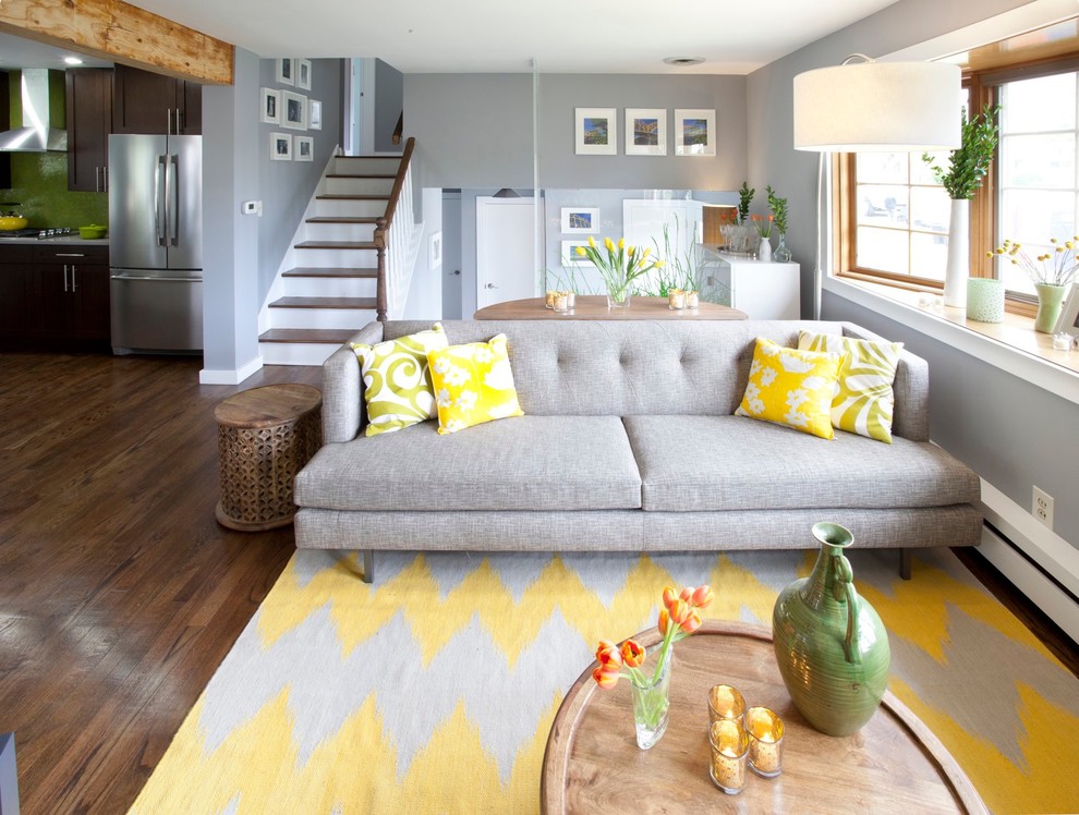 Transitional brown floor living room photo in New York with gray walls