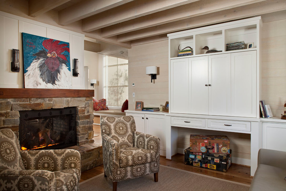 Example of a farmhouse living room design in San Francisco with a two-sided fireplace