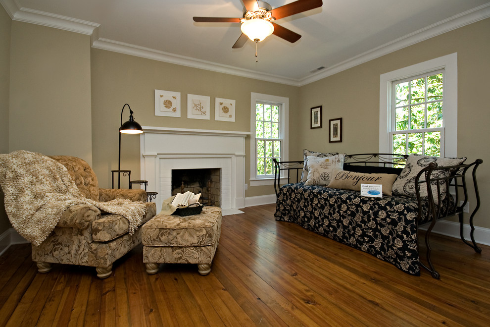 Mid-sized cottage formal and open concept medium tone wood floor and brown floor living room photo in Raleigh with brown walls, a standard fireplace, a wood fireplace surround and no tv