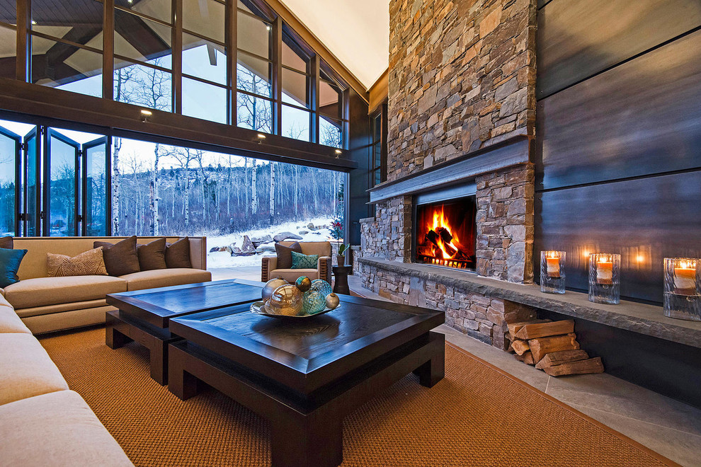 Inspiration for a rustic living room in Salt Lake City with a standard fireplace, a stone fireplace surround and no tv.