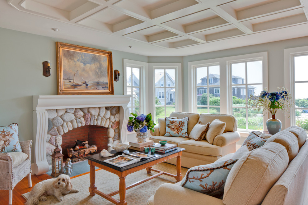 Inspiration for a mid-sized coastal formal and enclosed medium tone wood floor and brown floor living room remodel in Boston with green walls, a stone fireplace, no tv and a standard fireplace
