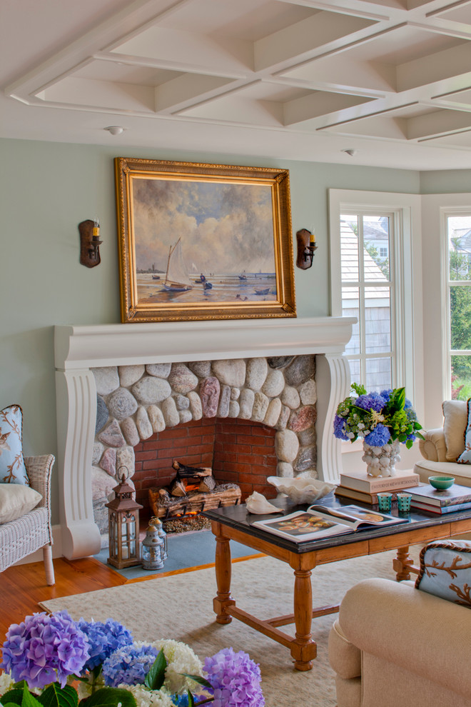 Inspiration for a mid-sized coastal formal and enclosed medium tone wood floor and brown floor living room remodel in Boston with green walls, a standard fireplace, a stone fireplace and no tv