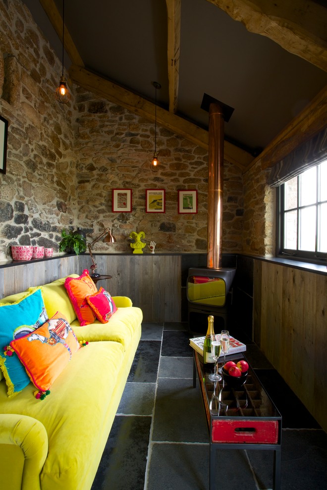 Photo of an eclectic living room in Devon with a wood burning stove.