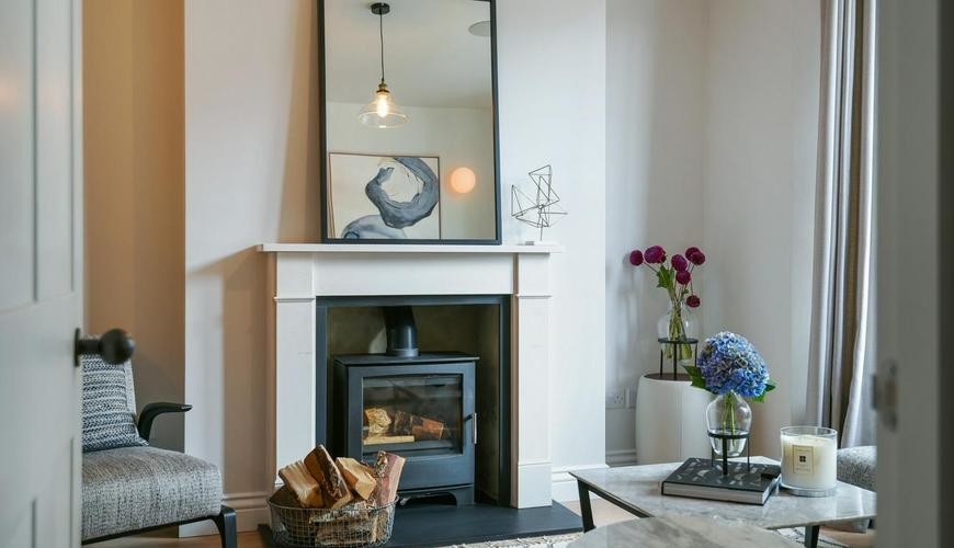 Large contemporary living room in London with a wood burning stove.
