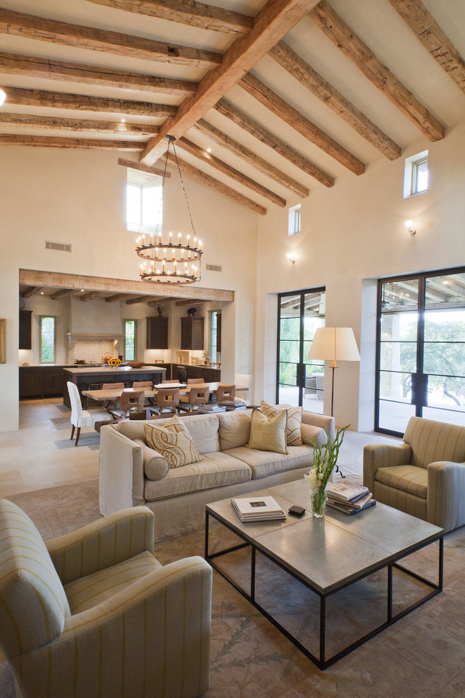 Inspiration for a mediterranean open concept living room remodel in Austin with beige walls