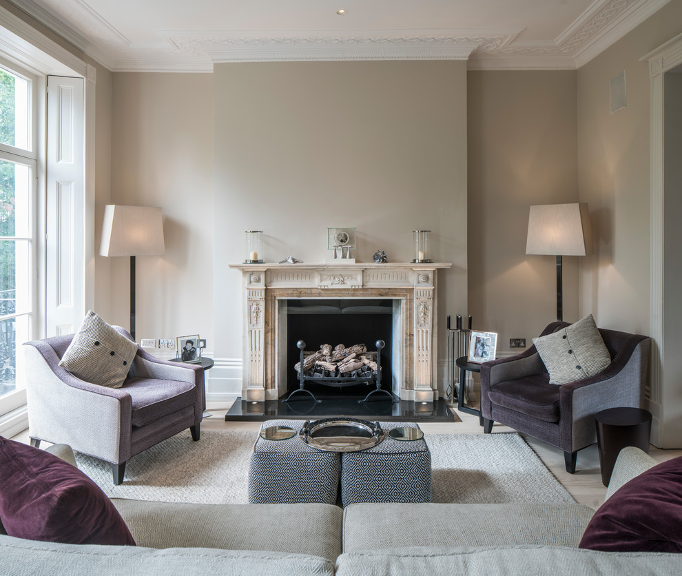 Medium sized classic enclosed living room in London with brown walls, a standard fireplace and a stone fireplace surround.