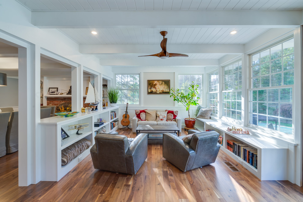 Example of a trendy open concept medium tone wood floor living room design in Philadelphia