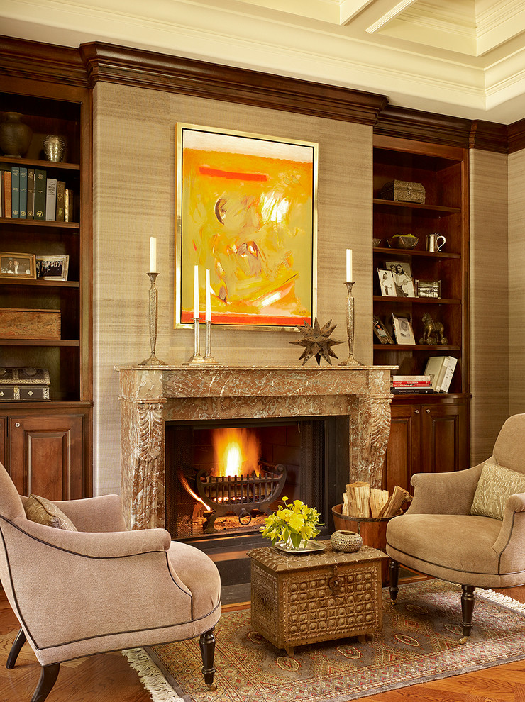 Elegant formal medium tone wood floor living room photo in San Francisco with beige walls, a standard fireplace and a stone fireplace