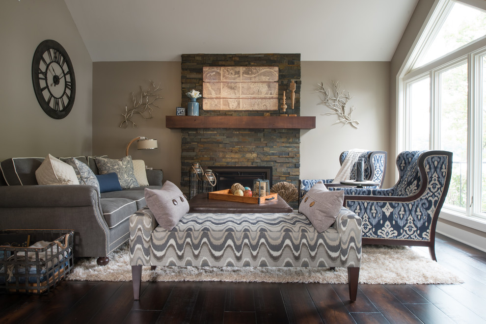 Inspiration for a medium sized classic formal open plan living room in Minneapolis with grey walls, dark hardwood flooring, a standard fireplace, no tv, brown floors and feature lighting.