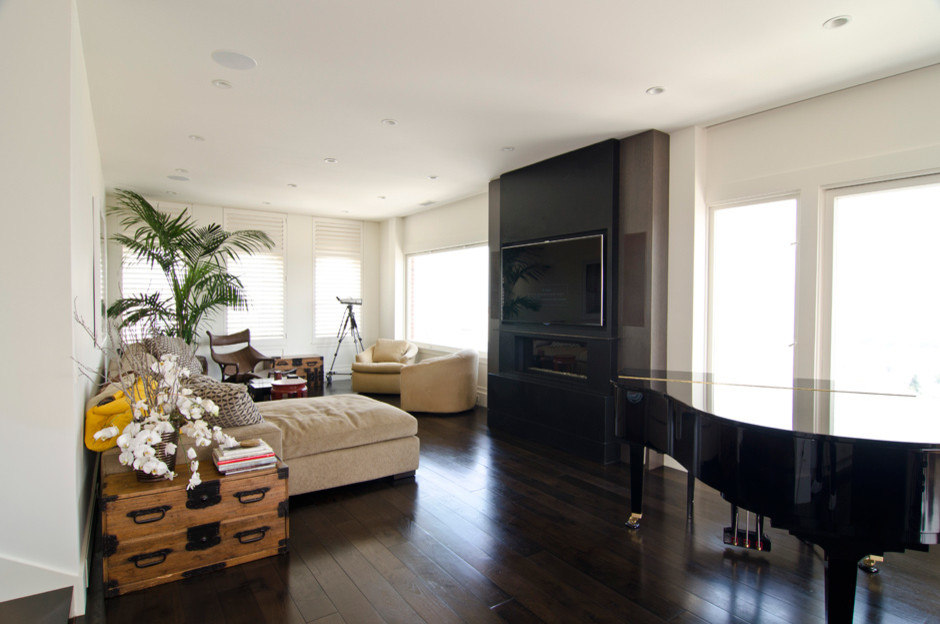 Photo of a medium sized contemporary open plan living room in San Francisco with a music area, white walls, dark hardwood flooring, a ribbon fireplace, a wall mounted tv and brown floors.
