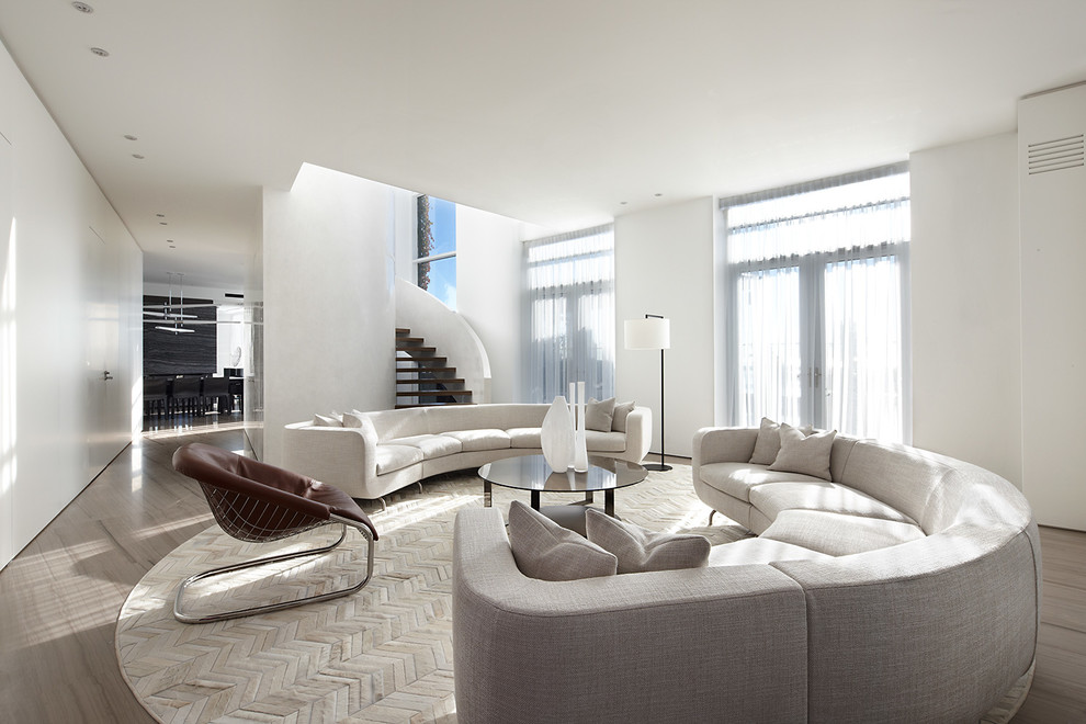 Example of a trendy brown floor living room design with white walls