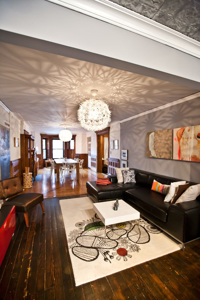 Immagine di un soggiorno minimal con pareti grigie e tappeto