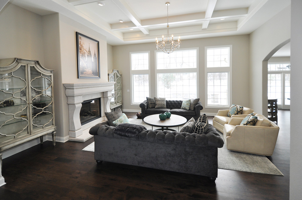 Inspiration for a mid-sized eclectic open concept dark wood floor living room remodel in Milwaukee with gray walls, a standard fireplace and a concrete fireplace