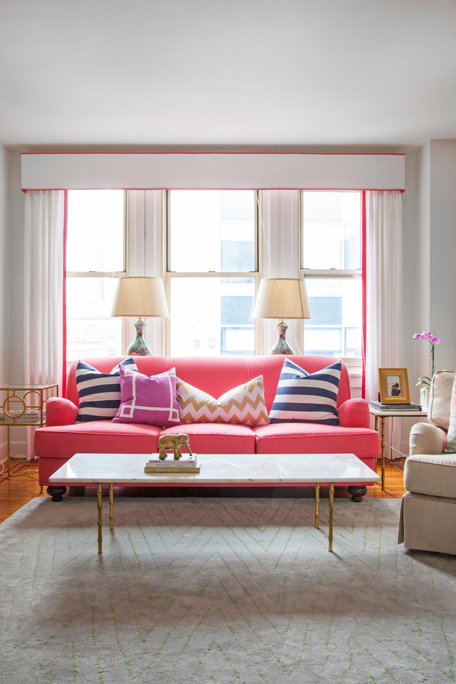 Transitional medium tone wood floor living room photo in Philadelphia with white walls