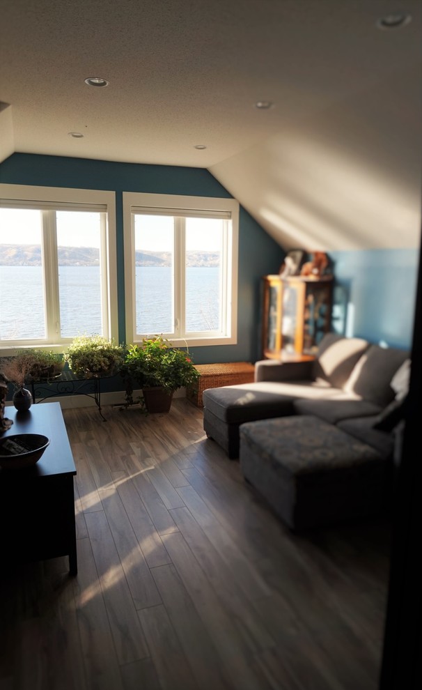 Small classic enclosed living room in San Diego with blue walls and medium hardwood flooring.