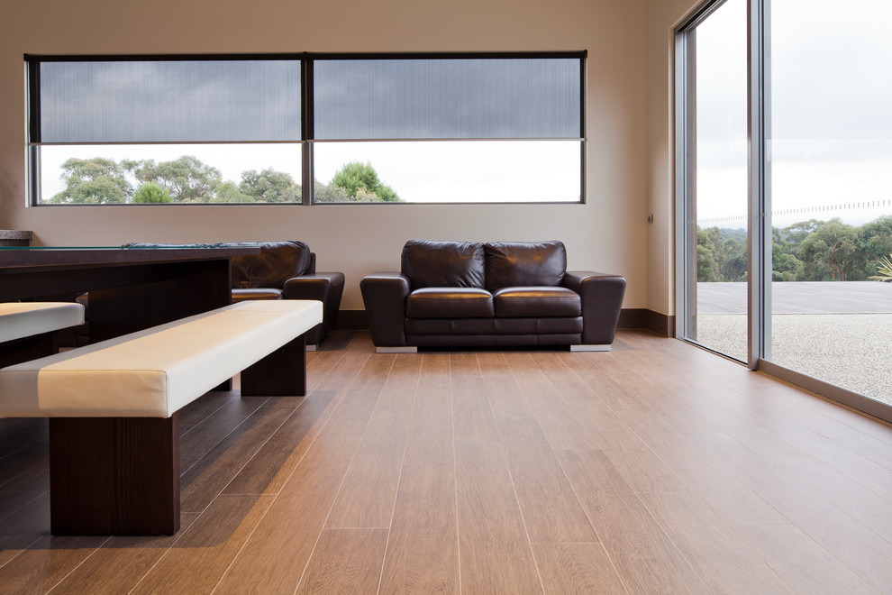 Inspiration for a contemporary open plan living room in Sydney with beige walls and porcelain flooring.