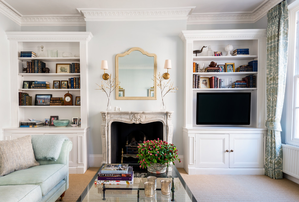 Inspiration for a medium sized classic formal enclosed living room in London with blue walls, carpet, a standard fireplace, a stone fireplace surround and a wall mounted tv.