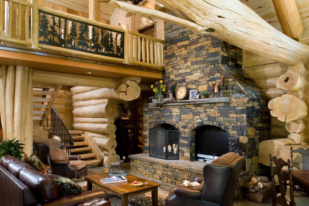 Photo of a rustic living room in Boise with a stone fireplace surround.