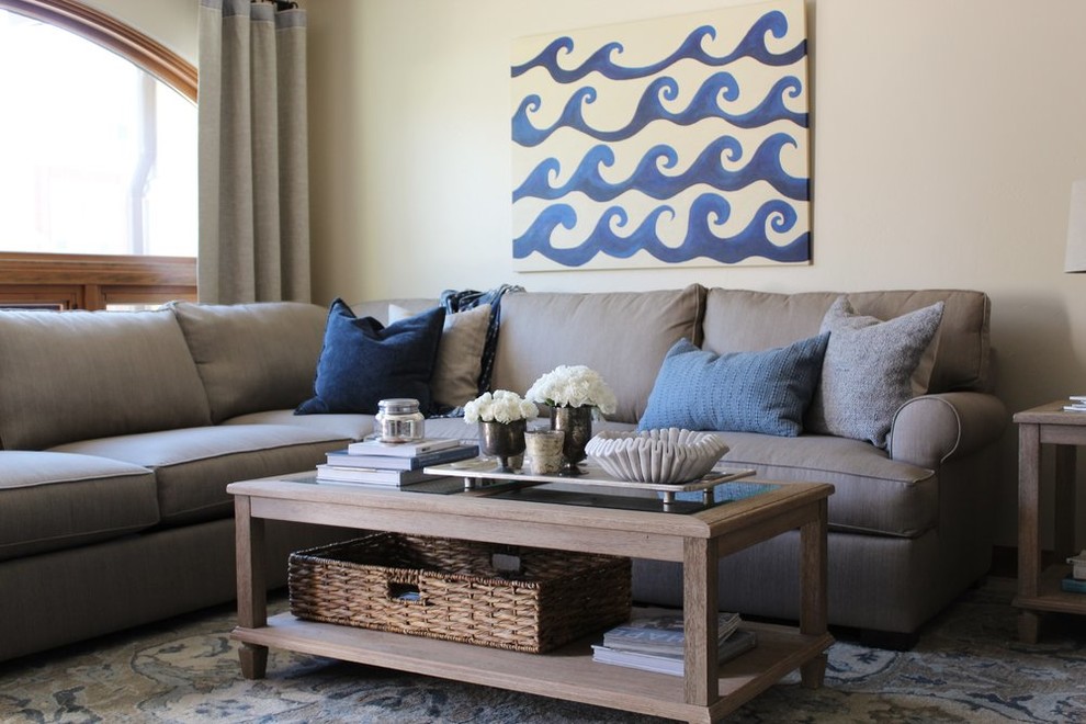 Example of a beach style limestone floor and beige floor living room design in San Luis Obispo with beige walls