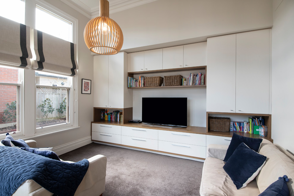 Example of a huge transitional formal and enclosed carpeted and gray floor living room design in Melbourne with beige walls and a tv stand