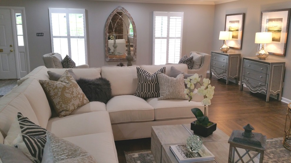 Example of a mid-sized transitional formal and open concept dark wood floor and brown floor living room design in Little Rock with gray walls, a standard fireplace and no tv