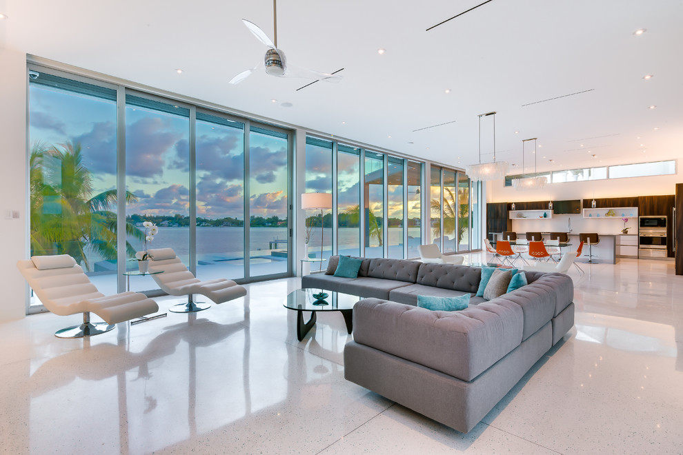 Expansive modern formal open plan living room in Tampa with white walls, ceramic flooring, no fireplace and no tv.