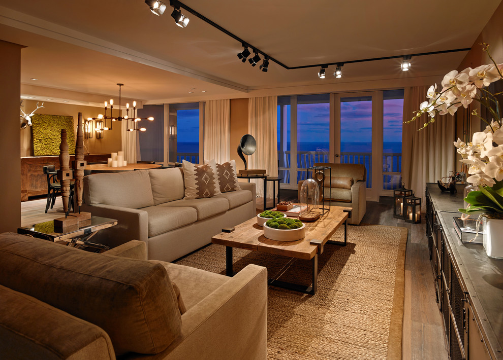 Example of a transitional open concept light wood floor living room design in Miami